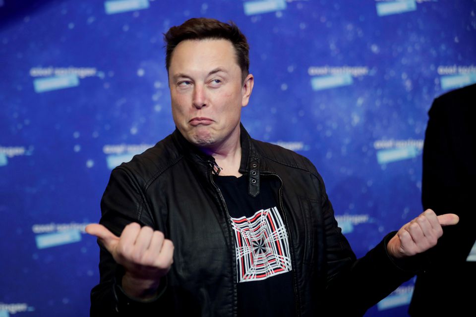 SpaceX owner and Tesla CEO Elon Musk grimaces after arriving on the red carpet for the Axel Springer award, in Berlin, Germany, December 1, 2020. — Reuters