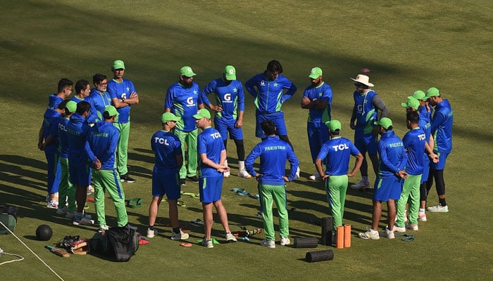 Pakistani cricketers gather before the start of the training session ahead of the first cricket Test match against New Zealand in the National Stadium in Karachi on December 24, 2022. — AFP