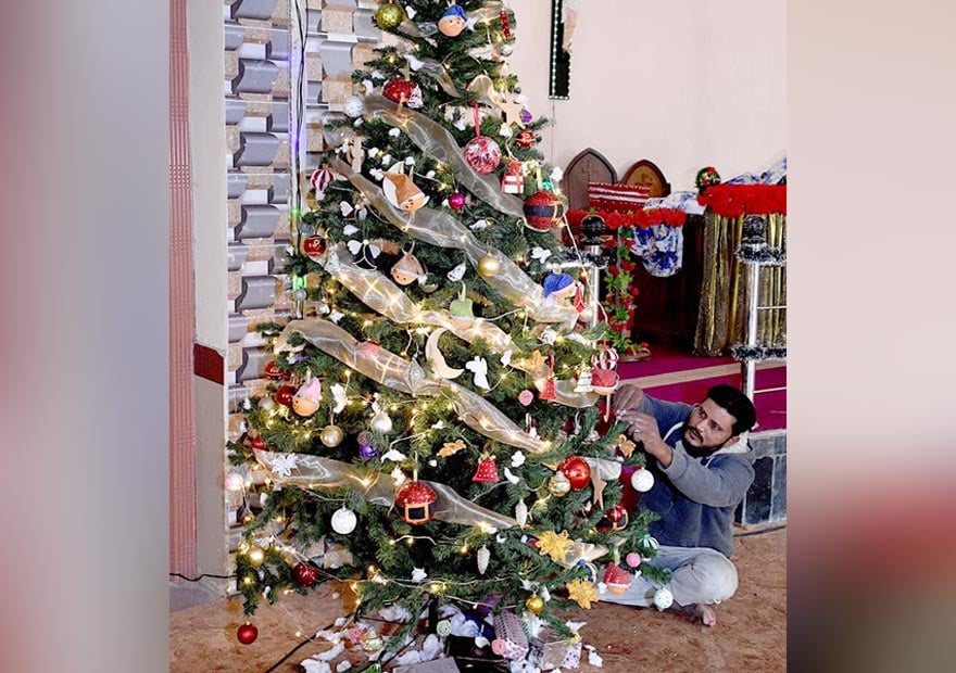 Christians decorate St Joseph Catholic Church on the eve of Christmas in Larkana on December 24, 2022. — APP