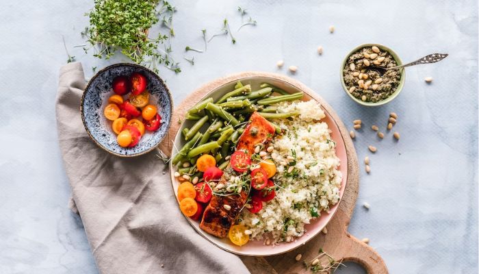 Image shows salmon and quinoa dish.— Unsplash