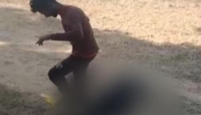 Screengrab shows man beating his partnerafter she allegedly refused to marry him.— NDTV/Twitter