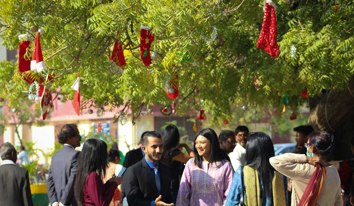 Friends and family meet one another following Christmas Day prayers at the church.