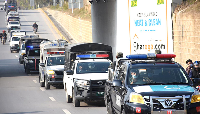 Islamabad Police during a flag march on February 5, 2022. — INP