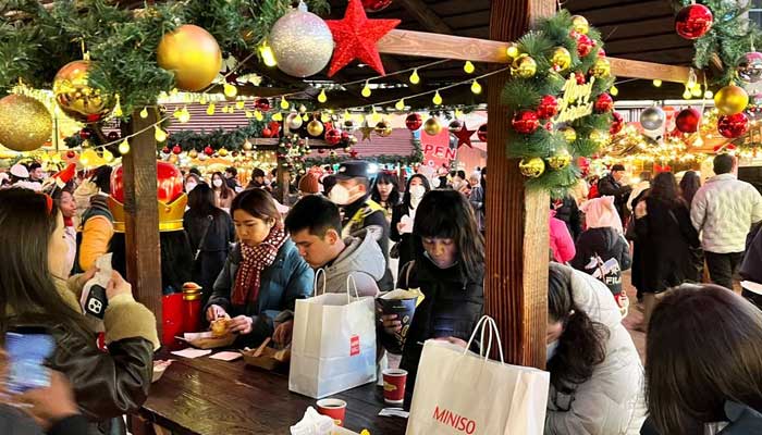 People visit a Christmas market, as coronavirus disease (COVID-19) outbreaks continue, in Shanghai, December 24, 2022. — Reuters