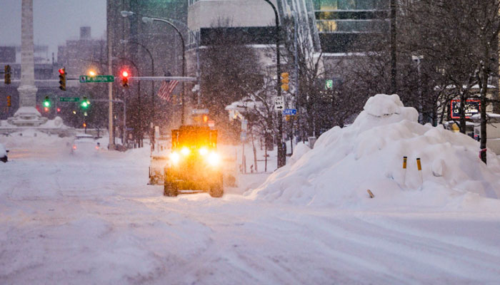 In this handout photo from the Office of Governor Kathy Hochul heavy snowfall blankets the streets of downtown Buffalo, New York, on December 26, 2022. US emergency crews counted the grim costs of a colossal winter storm that brought Christmas chaos to millions, especially in hard-hit western New York, where the death toll reached 25 Monday in what authorities described as a war with mother nature. AFP