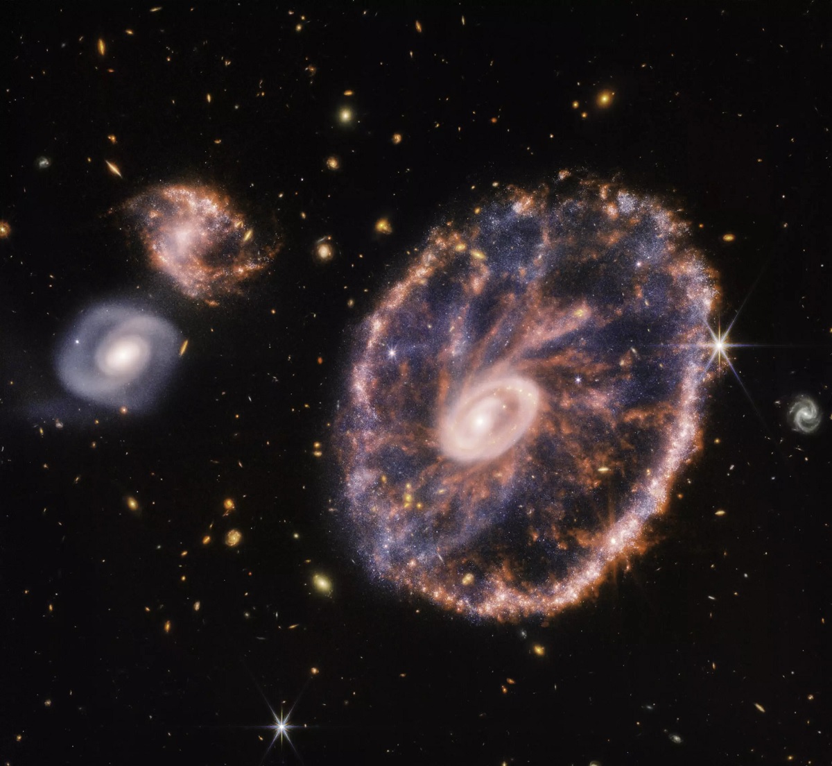 The Cartwheel Galaxy, a luminous circle of colour captured by the Webb telescope.— AFP