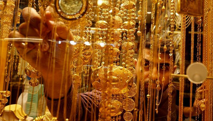 An Iraqi goldsmith arranges gold at his shop in December 5, 2020. — Reuters/File