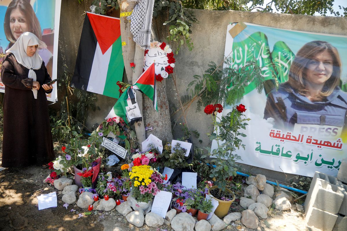 Palestinian woman takes pictures at the scene where Al Jazeera reporter Shireen Abu Akleh was shot dead during an Israeli raid, in Jenin, in the Israeli-occupied West Bank, May 17, 2022.— Reuters