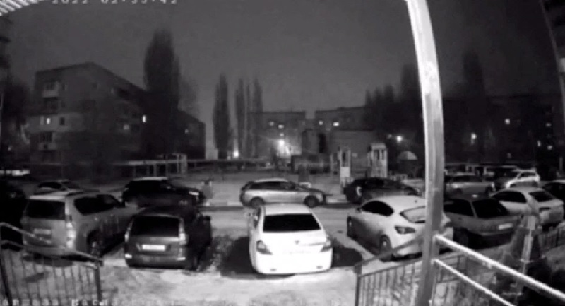 A surveillance camera shows how vehicles are illuminated by a flash of light from an explosion in this still image taken from a video obtained by Reuters and released on December 26, 2022, in Engels, Saratov Oblast, Russia.  Reuters