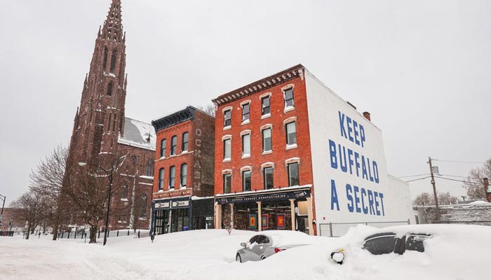 Abandoned cars are covered in snow on a road following a winter storm in Buffalo, New York, U.S., December 27, 2022. — Reuters