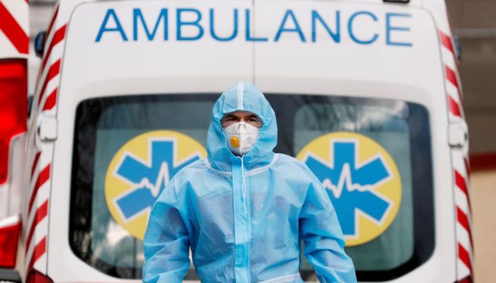 A medical worker wearing protective gear stands next to an ambulance outside a hospital for patients infected with COVID-19 in Kyiv, Ukraine, November 24, 2020.— Reuters