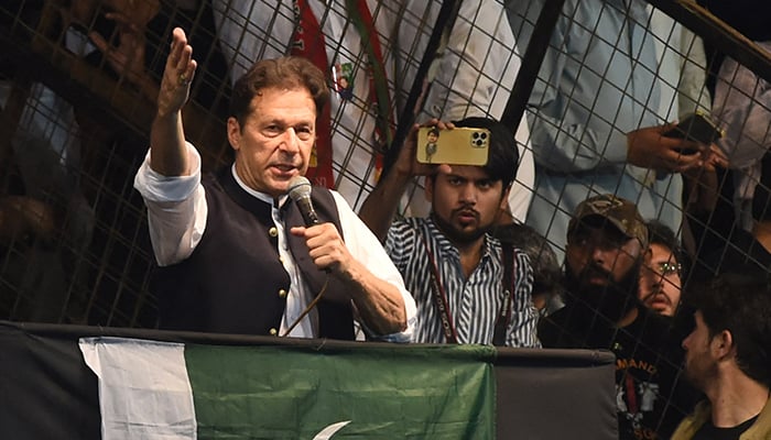 Former prime minister Imran Khan delivers a speech to his supporters during a rally celebrating the 75th anniversary of Independence Day in Lahore on August 13, 2022. — AFP