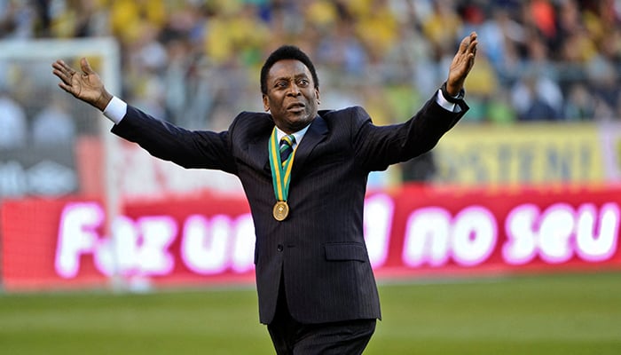 Pele acknowledges cheers from the audience as he enters Rasunda stadium, ahead of the friendly match between Sweden and Brazil, in Stockholm, Sweden, August 15, 2012. — Reuters