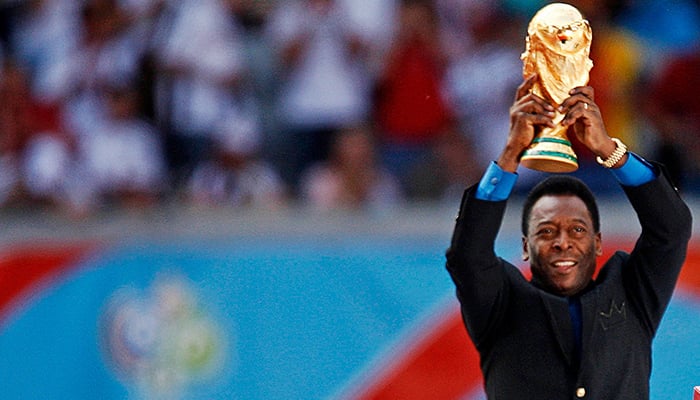 Pele holds the World Cup trophy during the World Cup 2006 opening ceremony in Munich, Germany, June 9, 2006. — Reuters
