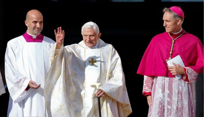 Emeritus Pope Benedict XVI waves as he arrives to attend a mass for the beatification of former pope Paul VI in St. Peters square at the Vatican October 19, 2014.— Reuters