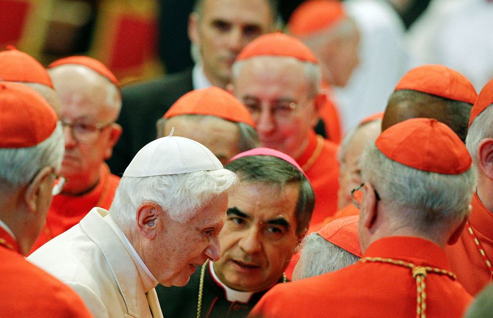 Pope Emeritus Benedict XVI is greeted by Cardinals as he arrives to attend a consistory ceremony in Saint Peters Basilica at the Vatican February 22, 2014.— Reuters