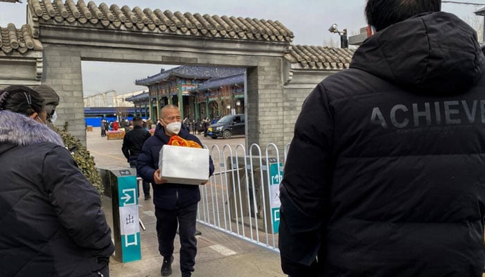 Workers at Beijing crematoriums say they are overwhelmed as China faces a surge in Covid cases that authorities warn could hit its underdeveloped rural hinterland during upcoming public holidays. AFP