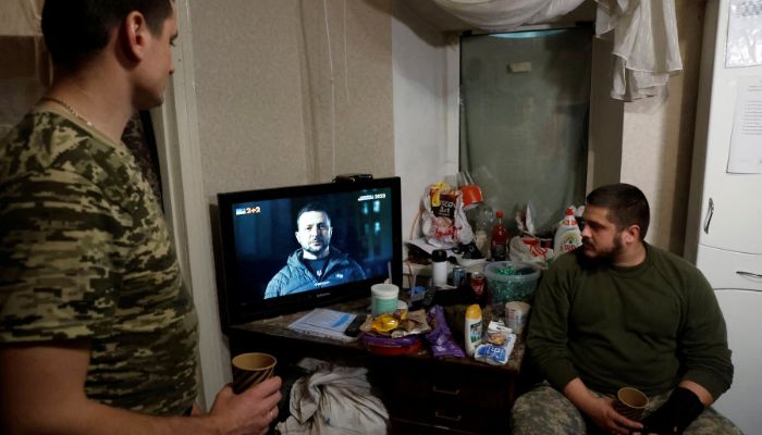 Ukrainian soldiers watch Ukraines President Volodymyr Zelenskiy’s New Years Eve address to the nation, in a military rest house, as Russias attack on Ukraine continues, in region of Donetsk, Ukraine, December 31, 2022.— Reuters