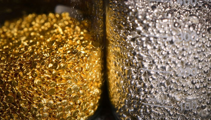 Granules of gold and silver are seen in glass jars at the Krastsvetmet non-ferrous metals plant in the Siberian city of Krasnoyarsk, Russia March 10, 2022. — Reuters/File