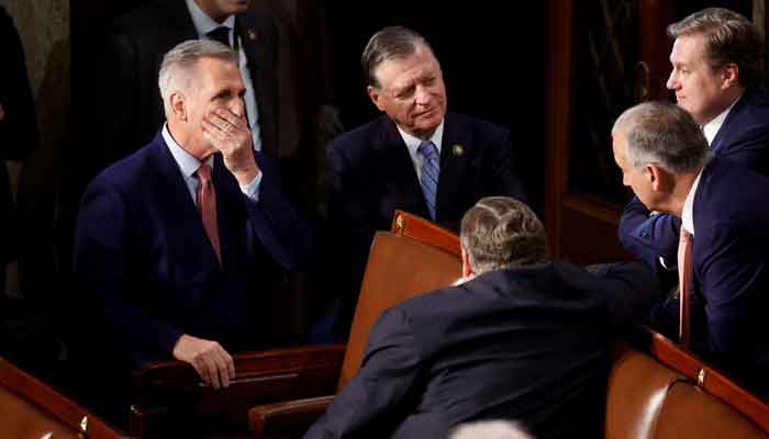 House Republican leader Kevin McCarthy (R-CA) puts his hand to his face as he talks with Republican House colleagues on the House floor during voting as he runs for election to be the next Speaker of the House on the first day of the 118th Congress at the US Capitol in Washington, US, January 3, 2023. —Reuters