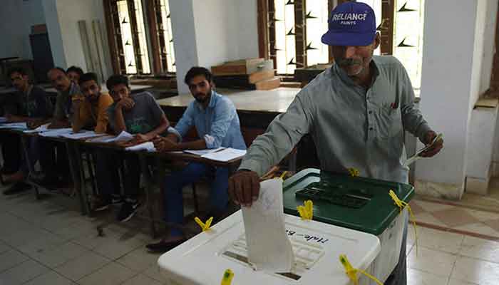 A man casts his vote at a polling station during the general election in Karachi on July 25, 2018. AFP/File