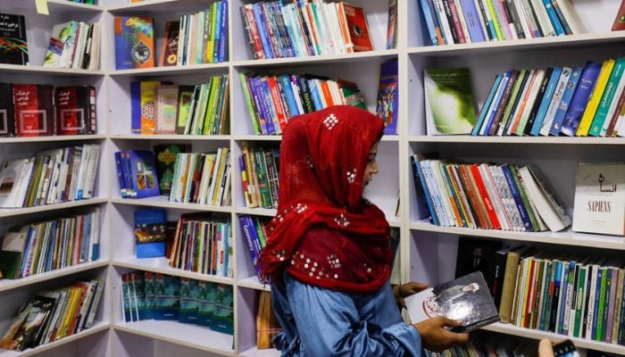 An Afghan woman attends the inauguration of womens library in Kabul, Afghanistan, August 24, 2022.— Reuters