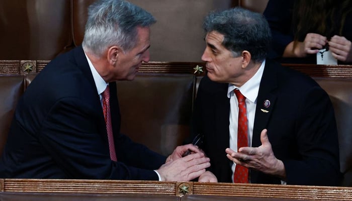 House Republican Leader Kevin McCarthy pleads his case one-on-one with Rep. Andrew Clyde. — Reuters