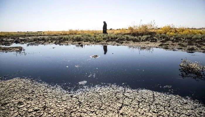 Water stagnated near a field after floods — AFP/file