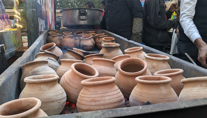 Matkas being warmed up in coals for Mumbai Wala stalls Matka Chai. — reporter