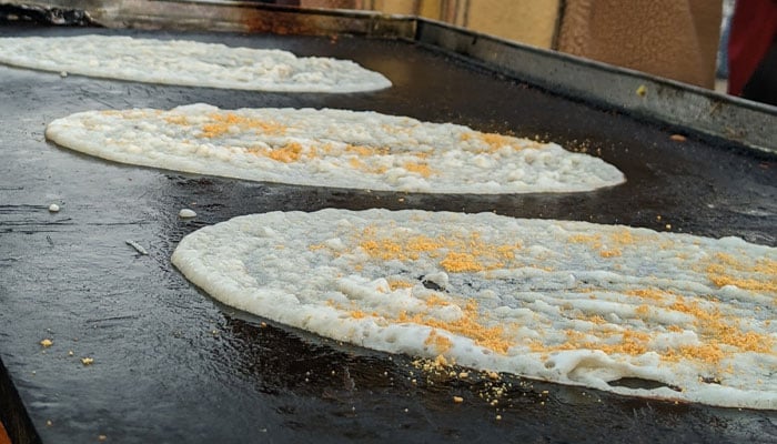 Dosas being prepared at KhauDosa stall at Karachi Eat Festival. — reporter.