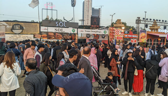 Attendants at Karachi Eat Festival 2023 in front of multiple food stalls. — reporter