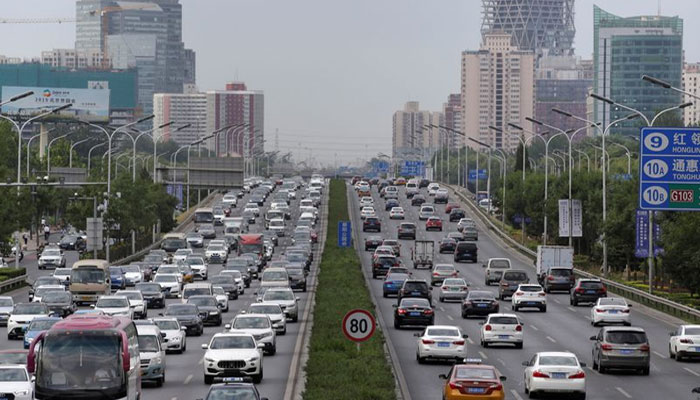 Cars drive on the road during the morning rush hour in Beijing, China. — Reuters/File