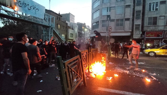 People light a fire during a protest over the death of Mahsa Amini, a woman who died after being arrested by the Islamic republics morality police, in Tehran. — Reuters/File