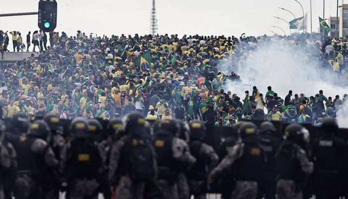 Security forces stand guard as supporters of former president Jair Bolsonaro demonstrate— Reuters