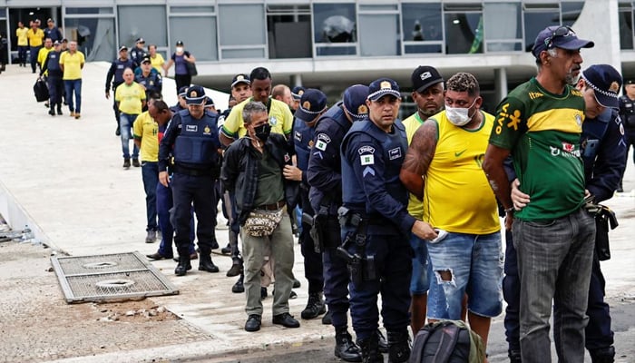 Security forces detain supporters of Brazils former president Jair Bolsonaro — Reuters