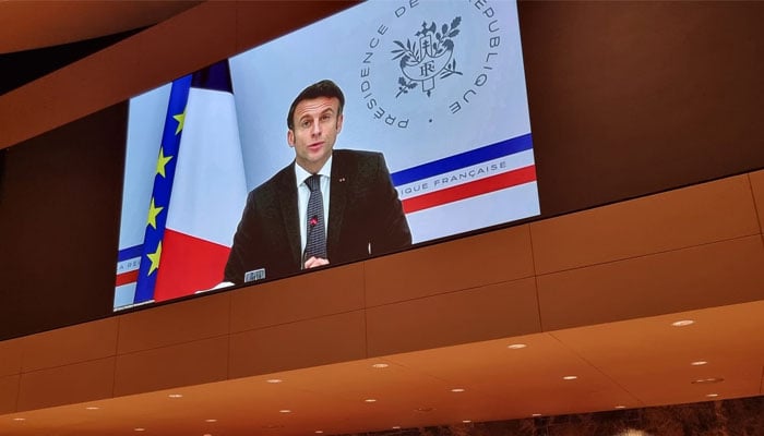 Frances President Emmanuel Macron addresses a summit on climate resilience in Pakistan via video message at the United Nations, in Geneva, Switzerland, January 9, 2023. — Twitter/UNDP