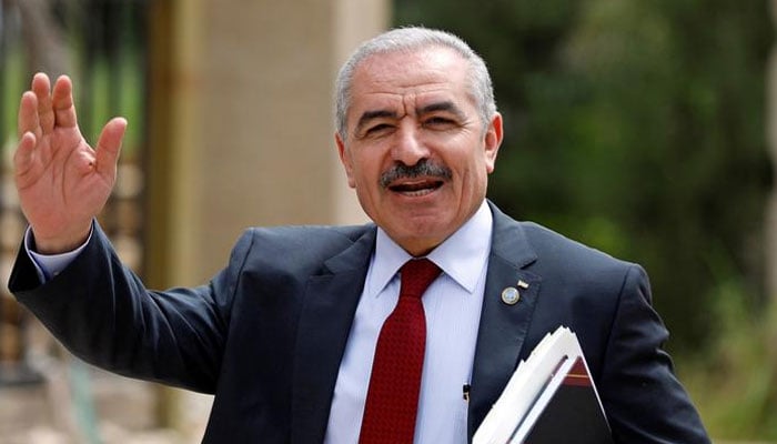 Palestinian Prime Minister Mohammad Shtayyeh gestures as he arrives for a cabinet meeting of the new Palestinian government, in Ramallah, in the Israeli-occupied West Bank. — Reuters/File