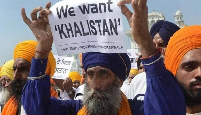 Sikhs hold up posters and placards in support of the Khalistan movement. — AFP/Files