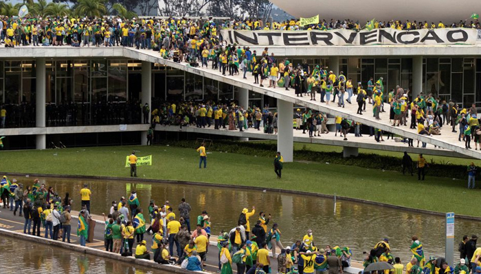 Bolsonaro supporters gather at Planalto Palace after invading the building.  — Rueters