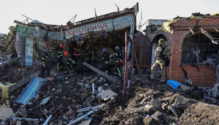 Ukrainian firefighters work at the site of a local market, heavily damaged by a Russian missile strike, amid Russias attack on Ukraine, in the Shevchenkove town, Kharkiv region, Ukraine January 9, 2023.— Reuters