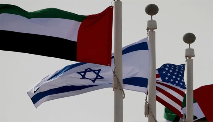 Emirati, Israeli and American flags fly upon the arrival of Israeli and US delegates at Abu Dhabi International Airport, in Abu Dhabi, UAE. — Reuters/File