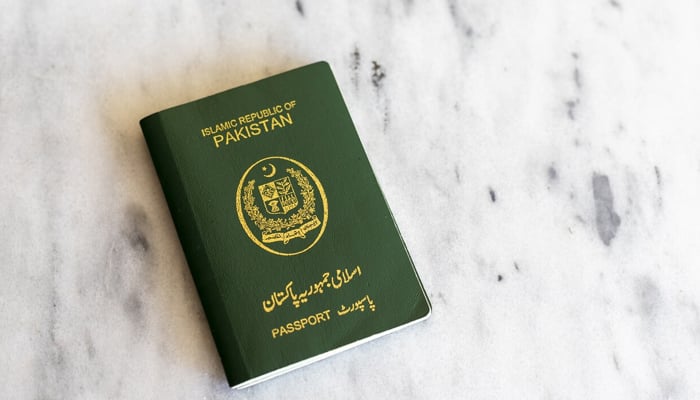 An undated photograph of the Pakistani passport. — Twitter/@visafoto_com/File