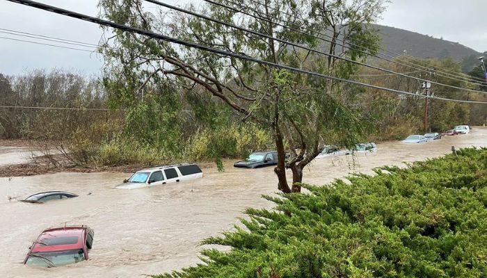 Cars are seen submerged in flood waters in Morro Bay, California, US, January 9, 2023 in this picture obtained from social media.— Reuters