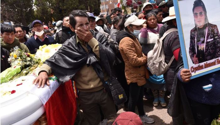 People react near the coffin of a person who died in violent clashes earlier this week, ignited by the ouster of leftist President Pedro Castillo, in Juliaca, Peru January 11, 2023.— Reuters