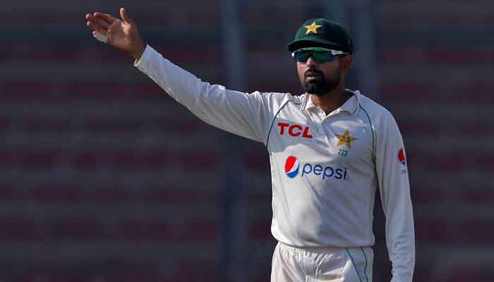 Captain Babar Azam makes field placings during the third England Test played at National Bank Cricket Arena, Karachi, December 18, 2022. — Reuters