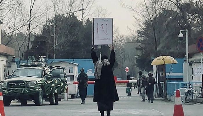 A student protests against the Talibans ban on womens higher education outside Kabul University in December 2022.— AFP