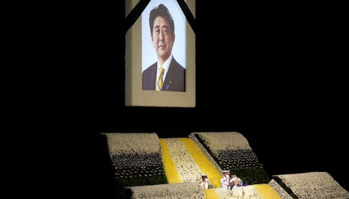 The portrait of former Japanese Prime Minister Shinzo Abe is seen at the altar during his state funeral at Nippon Budokan, in Tokyo, Japan, September, 27, 2022.— Reuters