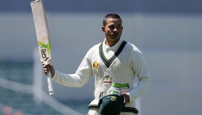 Australian batsman Usman Khawaja acknowledges the crowd as he walks off the field after being dismissed during the third day of the Third Test cricket match in Adelaide against South Africa. — Reuters/File