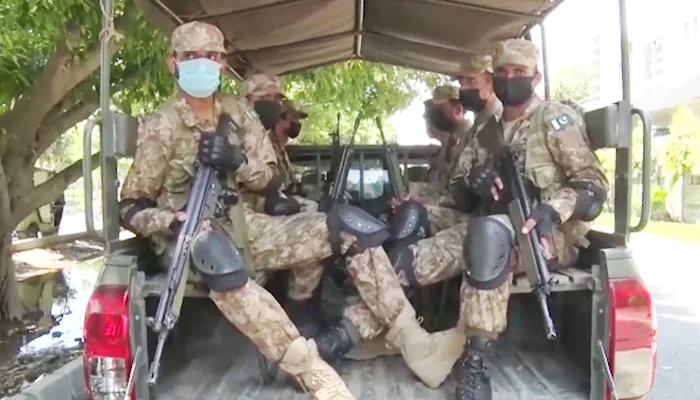 Pakistan Army troops can be seen in a military vehicle during reconnaissance at most sensitive constituencies ahead of the Punjab by-polls, on July 16, 2022. — ISPR