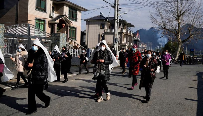 People attend the funeral of a woman in a village in Zhejiang province, China on January 9, 2023. — Reuters